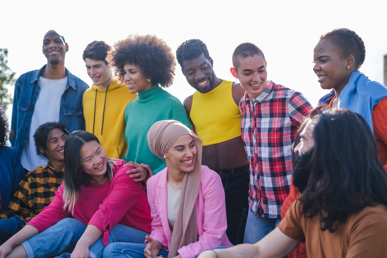 Group of friends from different cultures enjoying time outdoors